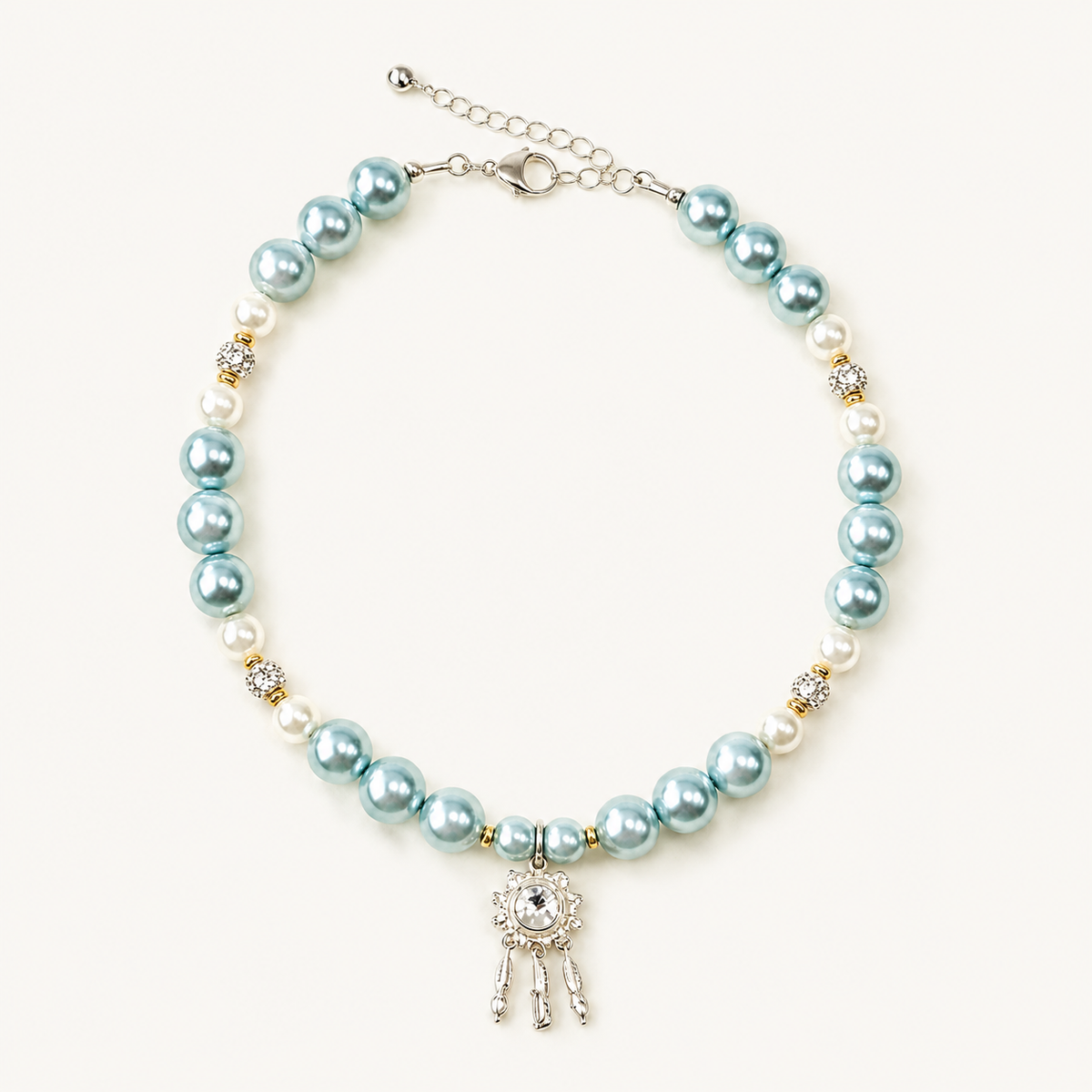 Aqua pearl-effect pet necklace with white accent beads and a silver-tone dreamcatcher pendant.