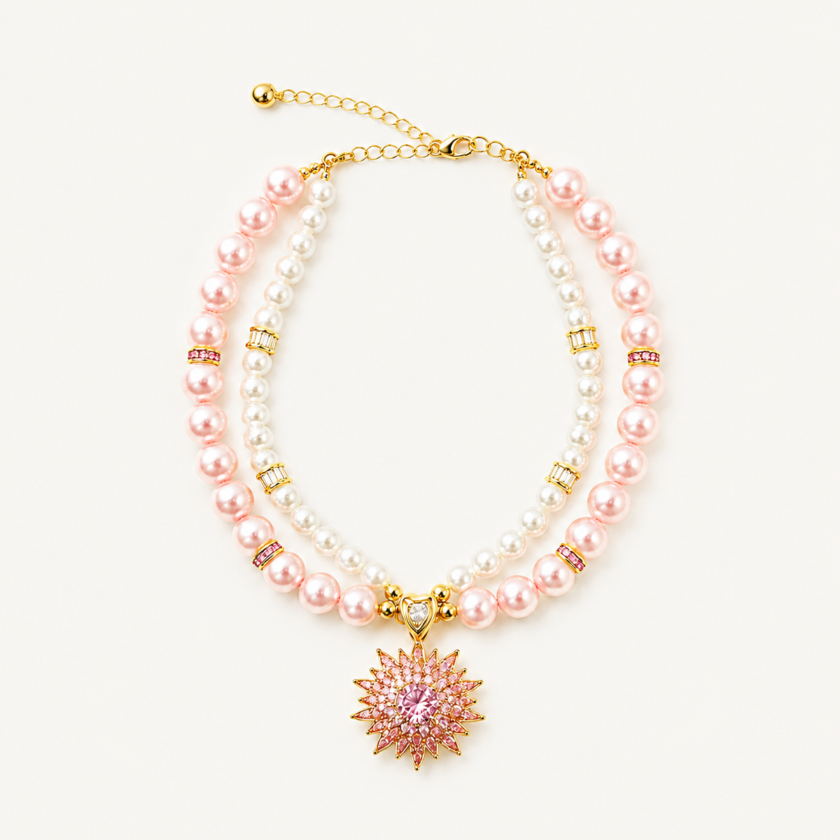 Double-strand pink and white pearl-effect pet necklace with a pink floral pendant on a white background.