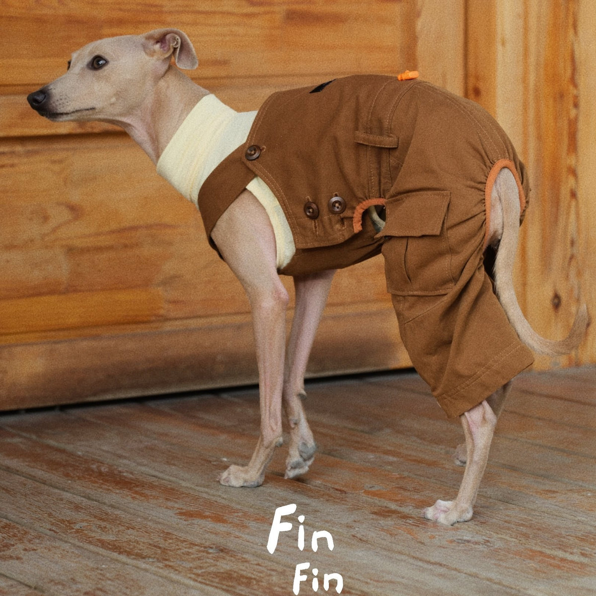 Side view of brown dog overalls with adjustable straps and metal hardware.