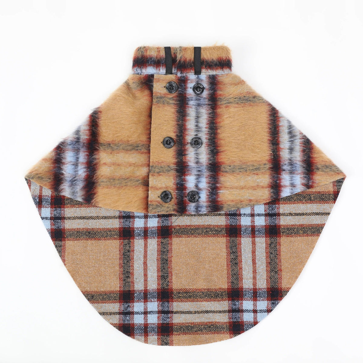 Tan and red plaid dog cape with front buttons, laid flat.