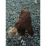 Overhead view of a brown dog utility bodysuit.
