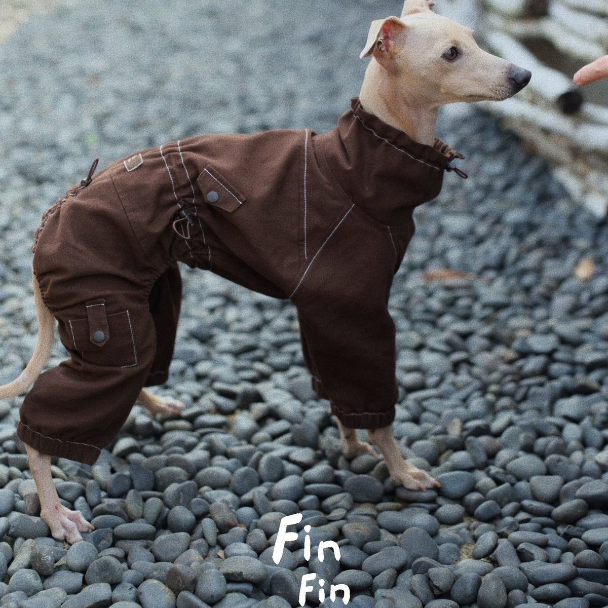 Side view of a brown dog utility suit with contrast stitching.