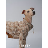 Close-up of the collar and zipper on a brown check dog jacket.