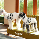 Side view of dogs wearing cream Fair Isle collared sweaters.