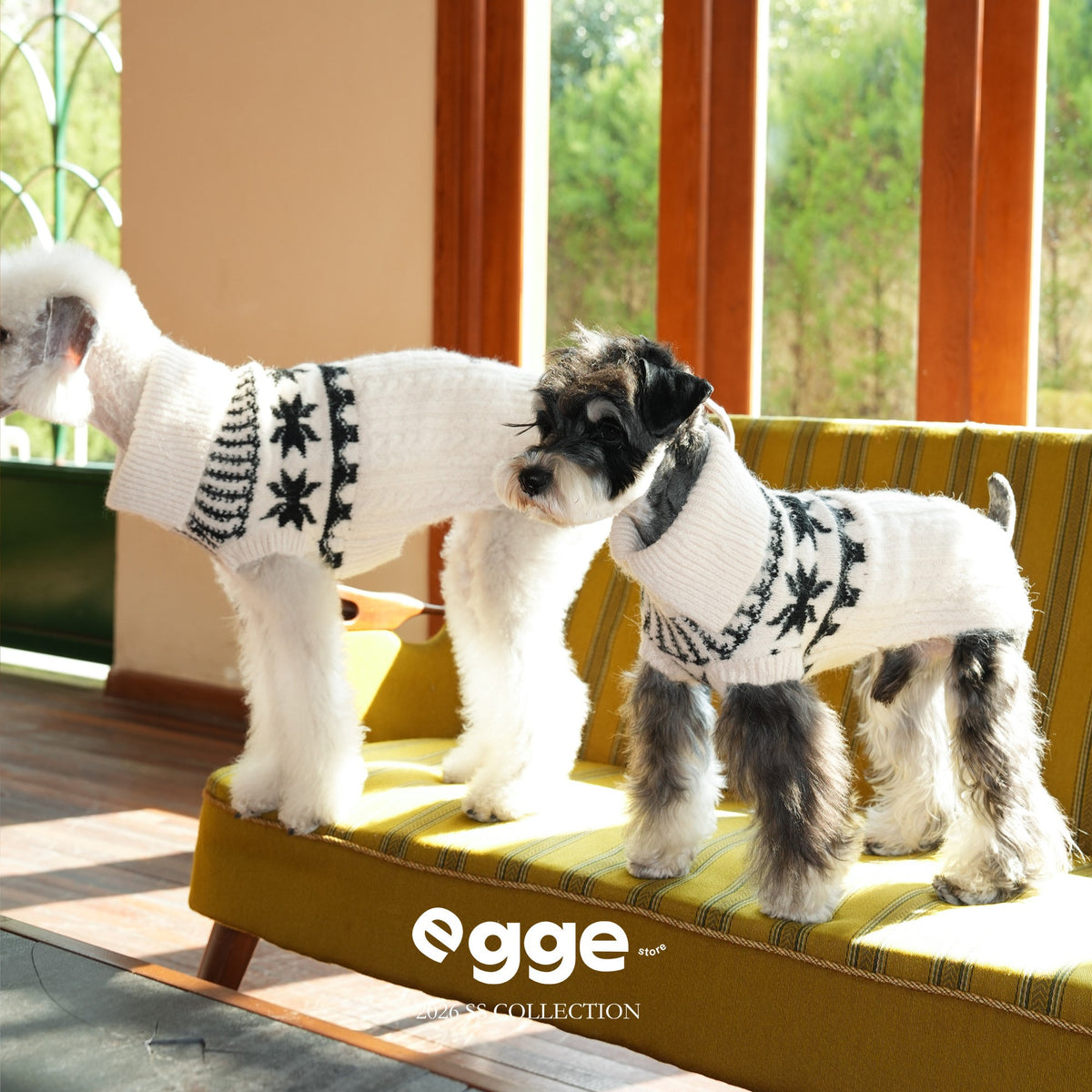 Side view of dogs wearing cream Fair Isle collared sweaters.