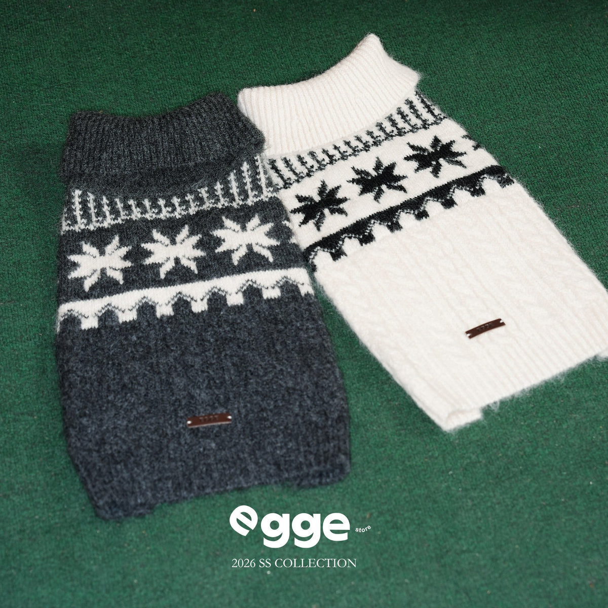Gray and cream Fair Isle dog sweaters laid flat.