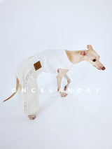 White dog trousers shown from the side as the dog bends forward.