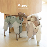 Dogs modeling mint and cream four-leg puffer suits.