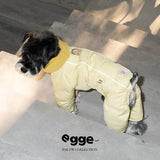 Side view of a yellow dog puffer jacket with seam and leash-ring details.