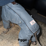 Gray dog puffer jacket with back zipper and leash ring.