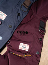 Burgundy and navy dog down jackets with buttons and leash attachment rings.