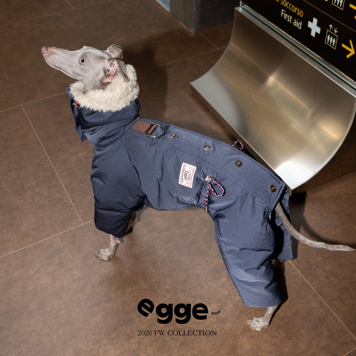 Side view of a navy dog puffer bodysuit with back fastenings.