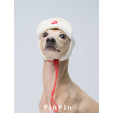 Front view of a cream dog aviator hat with red tie cords.
