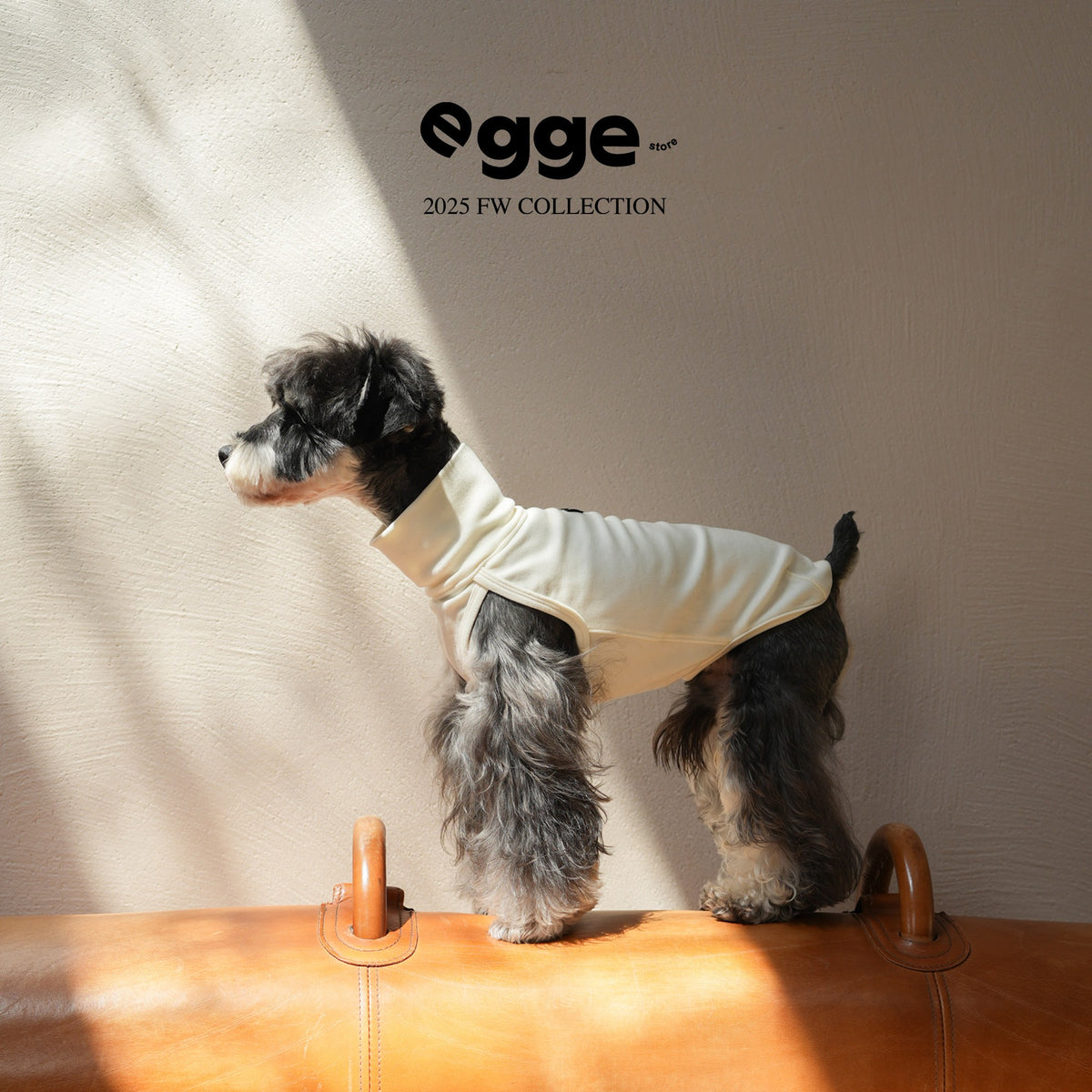 Side view of a cream sleeveless dog tank top.