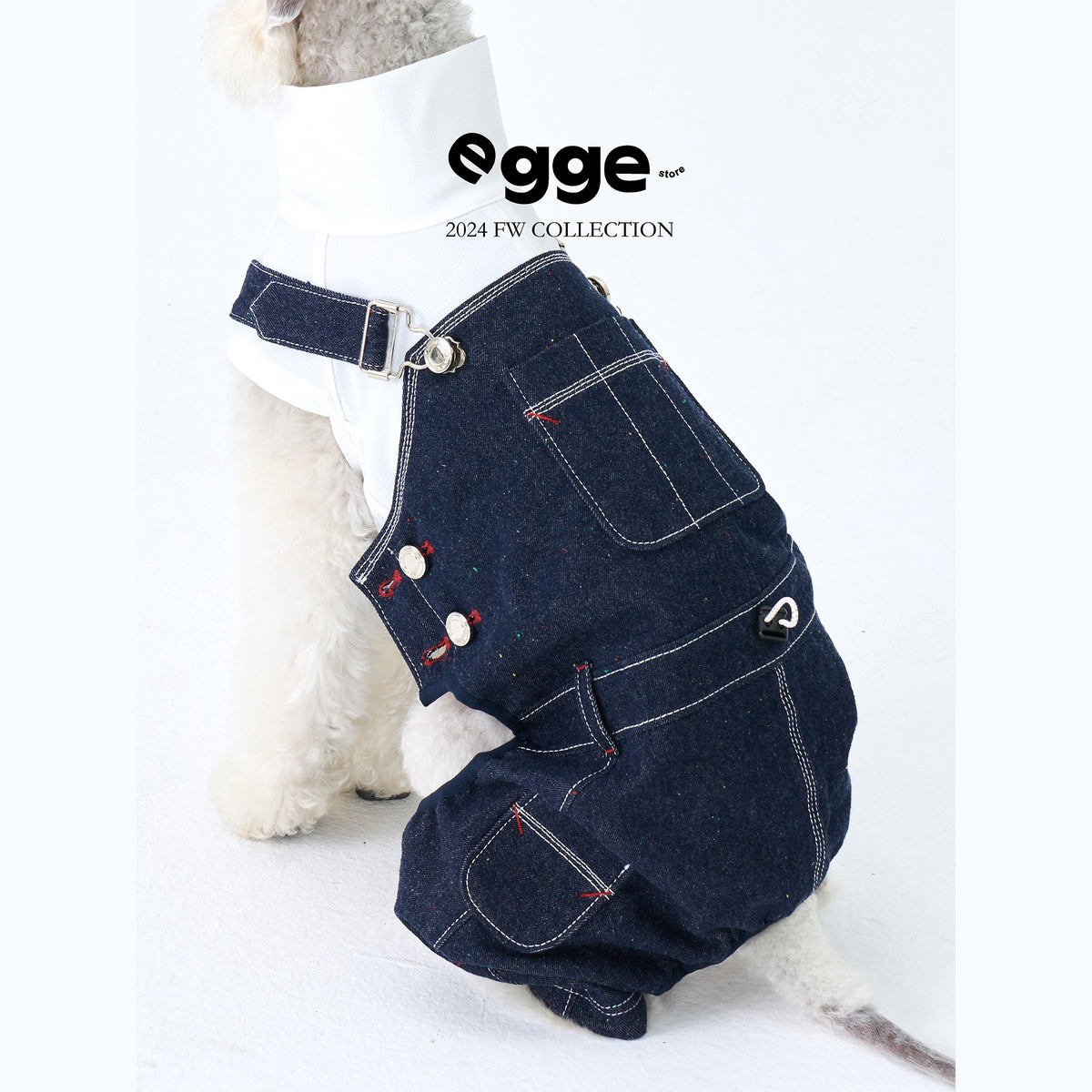 Denim dog overalls with adjustable shoulder straps and stitched pockets.