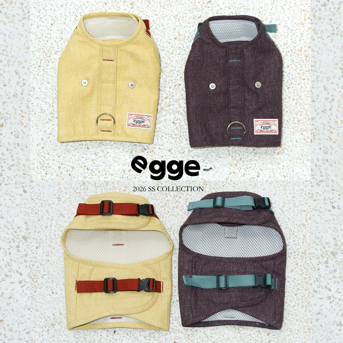 Yellow and dark harness vests laid flat to show front and buckle straps.