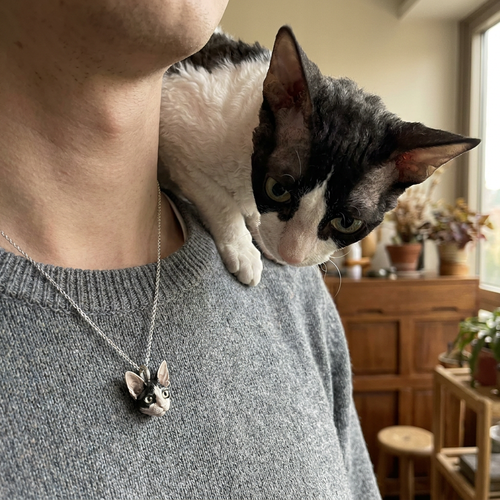 Handcrafted custom pet portrait pendant in 925 sterling silver with detailed facial features