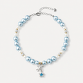Pale blue pearl-effect pet necklace with white accent beads and a blue star charm.