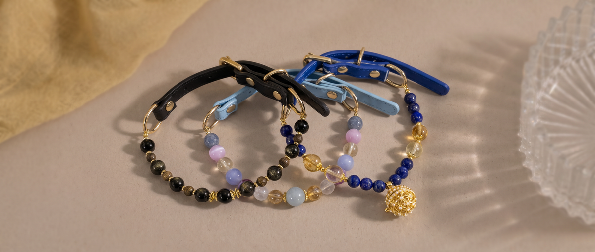 Colorful natural gemstone pet jewelry collars with leather straps and gold-tone details