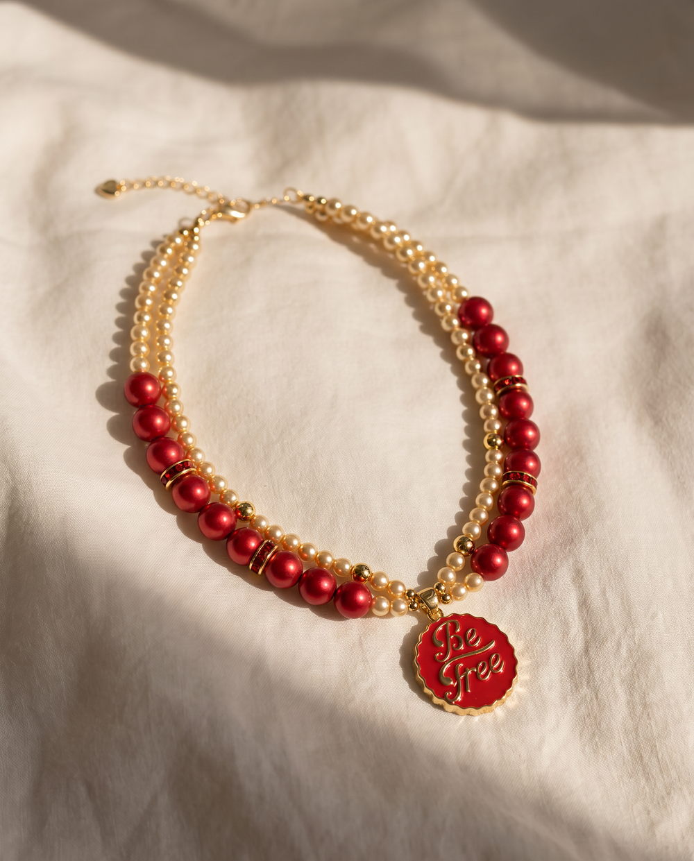 Ruby Heart crimson pearl-effect dog necklace with gold-tone Be Free pendant
